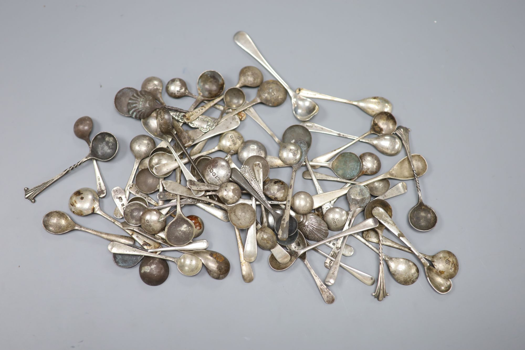 Approximately sixty seven assorted 20th century condiment spoons, gross 9oz.